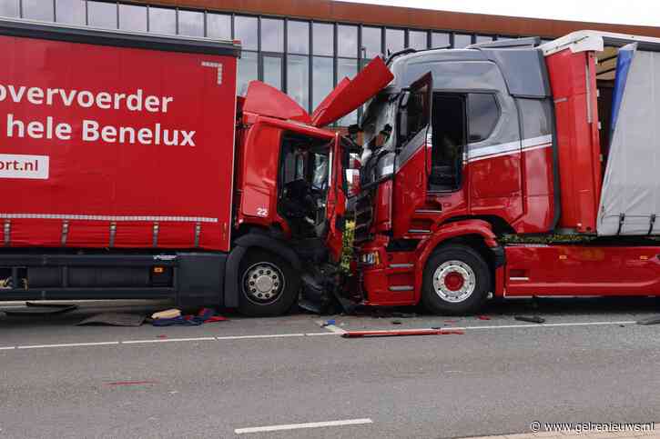 Vrachtwagenchauffeur bekneld na frontale crash