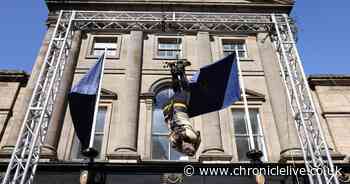 Magician wows crowds in Newcastle with dramatic upside-down escape stunt