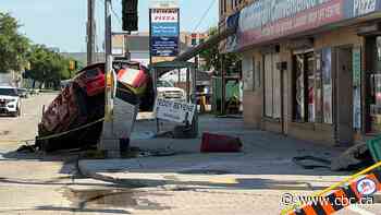 Crash that left Mustang hung up on traffic signal box involved speeding, impaired driver: Winnipeg police