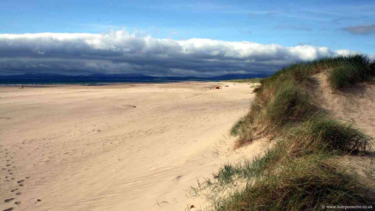 Ancient North Wales town with traditional shops, cafés and sandy beach