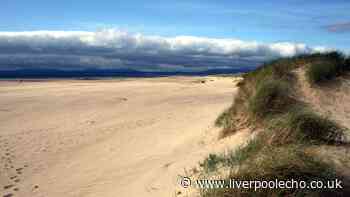 Ancient North Wales town with traditional shops, cafés and sandy beach