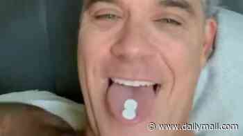 Robbie Williams pokes fun at viral World Cup moment after fans saw 'white substance falling on microphone' live on TV