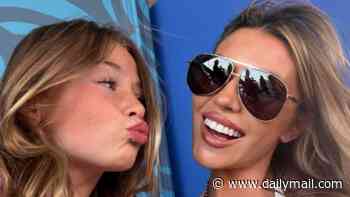 Abbey Clancy pouts for selfies with her lookalike children while watching the World Cup final in America