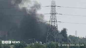 Thick smoke billows from large barn fire