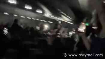 Moment prankster pilot 'tells a plane-load of Argentina fans THEY won the World Cup, leaving them dancing in the aisles... before brutally cutting the celebrations short'