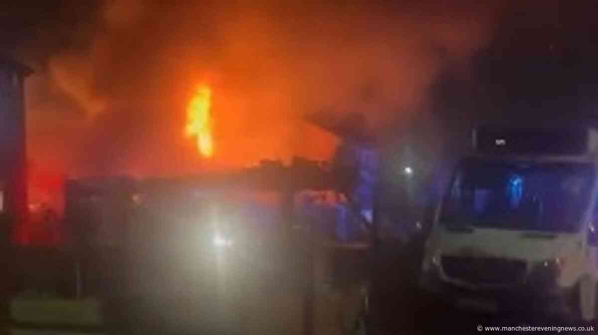 Huge flames engulf Manchester home as blaze breaks out