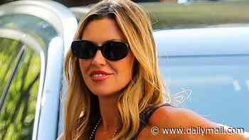 Abbey Clancy makes a glam exit with her family from a NYC hotel after they attended the World Cup final