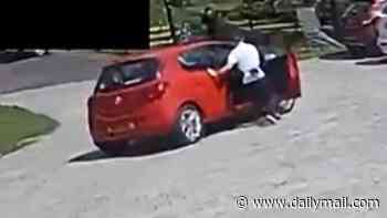 Moment hero teen jumps into rolling car and pulls handbrake just seconds before it collides with parked vehicles