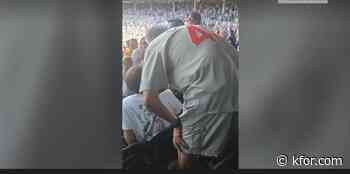 Watch: Man slaps fan not standing for national anthem at Cubs game