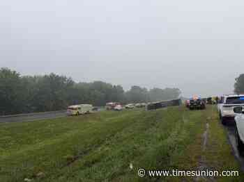 Bus carrying passengers overturns on Thruway