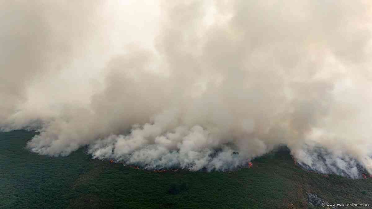 Firefighters still battling wildfire and issues warning to two communities