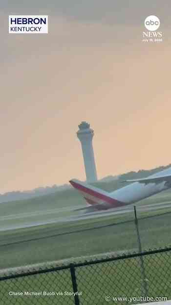 Sparks fly from tail of cargo plane during attempted landing