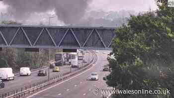M4 shut one way as car fire causes long delays- live updates