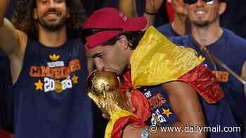 Spain's World Cup hero Ferran Torres dons 'Make Spain Great Again' cap during victory parade - with Trump's White House claiming: 'Everyone wants in on the movement'