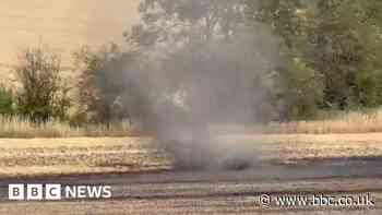Watch: Dust devil spotted in field after wildfire