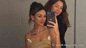 Michelle Keegan shows her down-to-earth side as she keeps her 'pits dry'  during a day of hot meetings before showing off her close bond with The Blame co-star Douglas Booth