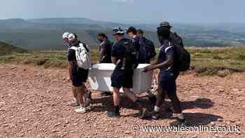 Man apologises for 'mindless' act on Pen y Fan as disgusted rugby team step in