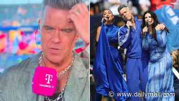 We all saw a mystery white lump fall on Robbie Williams' mic at the World Cup. He's given a cheeky explanation, but to me it's not a good look: LIZ JONES