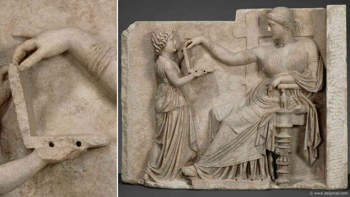 Ancient Greek statue holding a 'laptop' fuels surge in claims that time travel is real