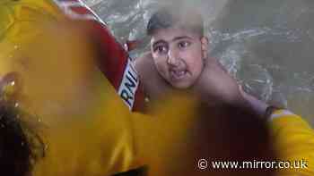 Dramatic footage shows the 'miracle' rescue of two boys who were seconds from death