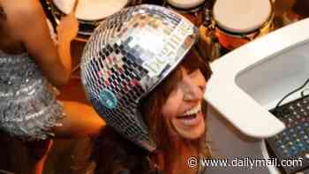 Davina McCall wears silver plunging unitard and disco ball helmet as she goes wild at rave after reports she married her husband a second time at £3.4million Kent home