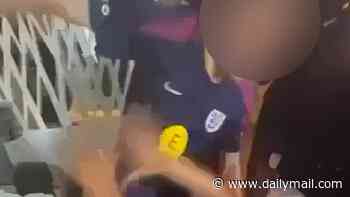 Shocking moment England youth stars scrap in wild hotel brawl as team-mates stand around laughing and recording on their phones instead of breaking up fight