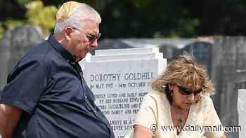 Amy Winehouse's parents Mitch and Janis visit the singer's grave to pay their respects on the 15th anniversary of her death