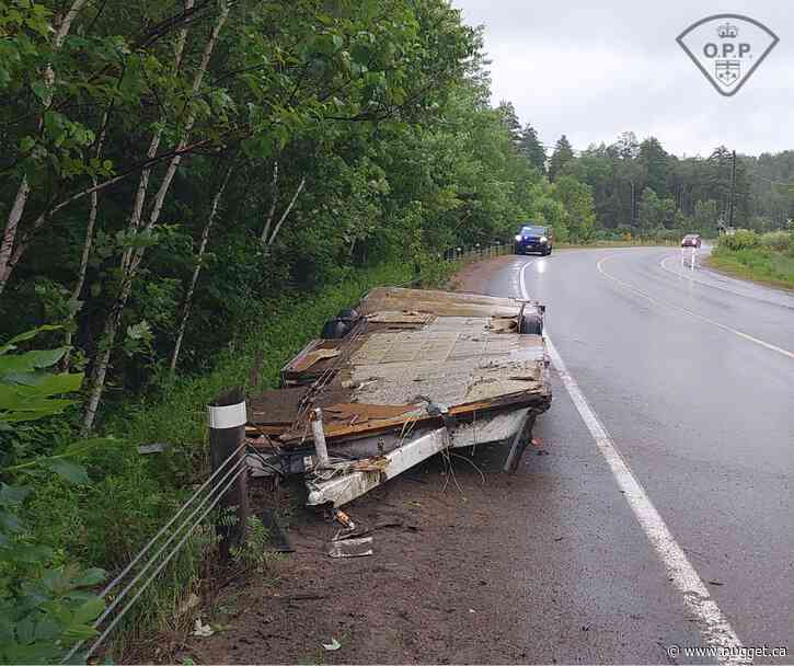 OPP seek driver after trailer breaks loose, damages East Ferris guardrail