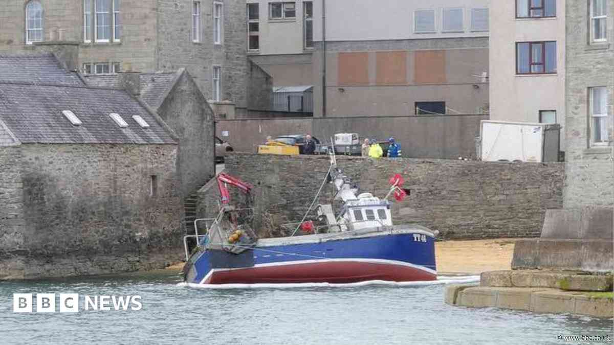 Fishing boat runs aground on Lerwick beach