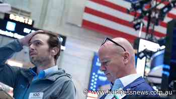 Wall Street falls as investors digest tech earnings
