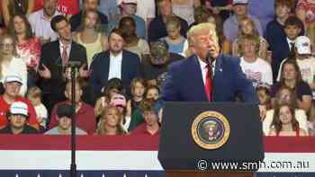 Trump mocked by audience member directly behind him