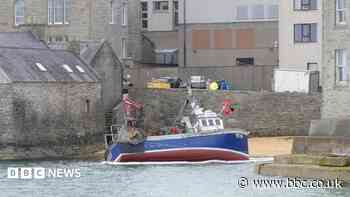 Fishing boat runs aground on Lerwick beach