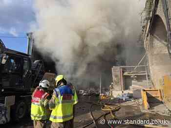 Brixton fire: Firefighters battle through night to contain huge blaze at waste facility