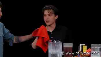 Tom Holland becomes the first celebrity to fall sick live on air after taking on the Hot Ones challenge
