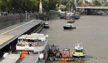 Police boat crashes into bridge in central London, sending officers into the Thames