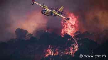 Raging wildfires in France and Spain force tens of thousands of people to flee