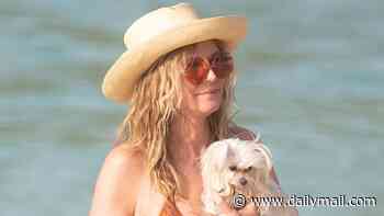 Heidi Klum, 53, flaunts supermodel frame in a cheeky bikini as she enjoys beach day with son Henry Samuel, 20, in St Barts
