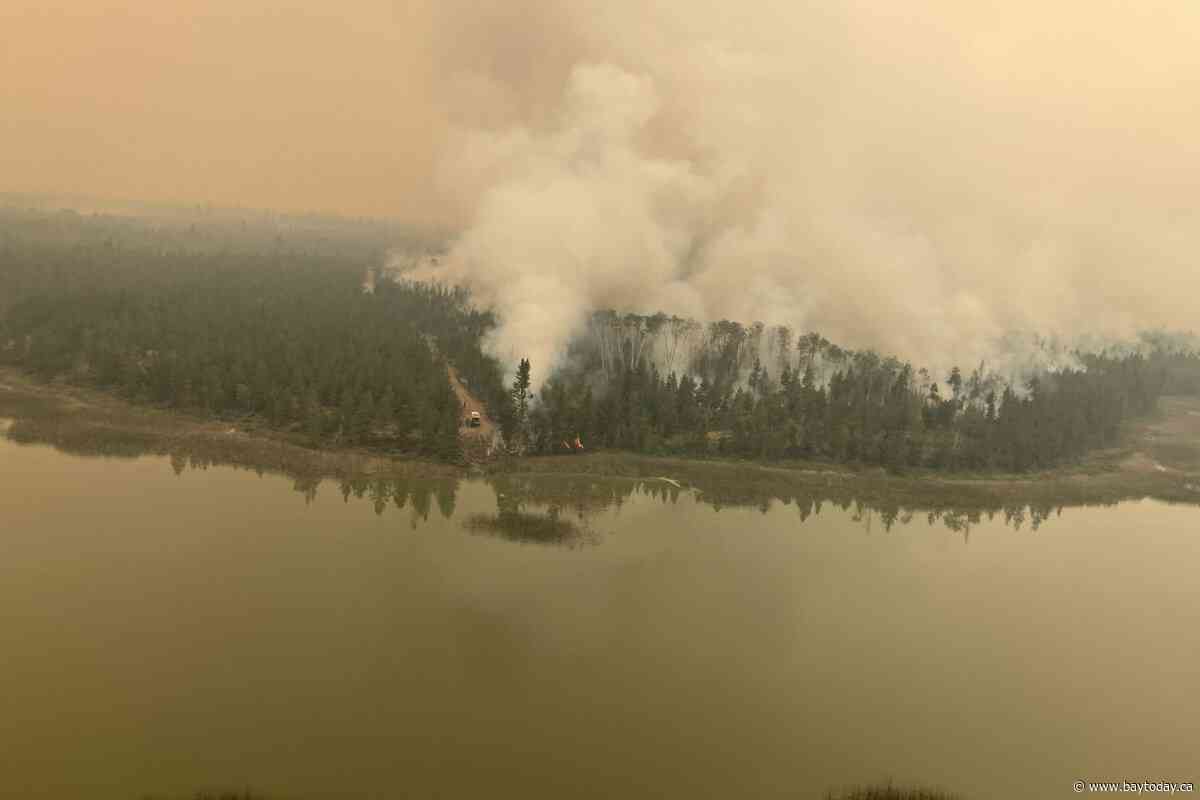 Two wildfires merge in Boston Bar, B.C., as more properties under evacuation alert