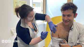 First person gets new experimental vaccine for Ebola