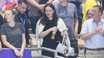 Pregnant Holly Ramsay takes a seat in the stands to watch husband Adam compete in the 100m breaststroke at the Commonwealth Games as he bags a place in the final