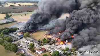 Twenty firefighters hospitalised after explosion sparked massive blaze that destroyed three fire engines at Essex industrial unit