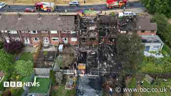 Arson arrest after terraced houses damaged in fire