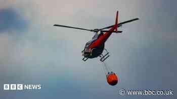 Helicopter brought in to tackle wildfire as blaze seen from space