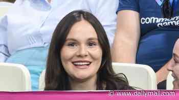 Pregnant Holly Ramsay smiles as she arrives to watch husband Adam's 100m breaststroke final at the Commonwealth Games