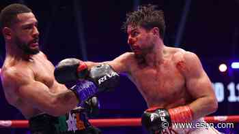 Kelly defends title, wants 'Boots' Ennis next