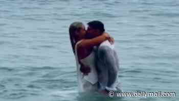Love Island's Lucie Donlan runs into the ocean in her wedding dress with husband Luke Mabbott as they tie the knot in Cornwall after five-year engagement