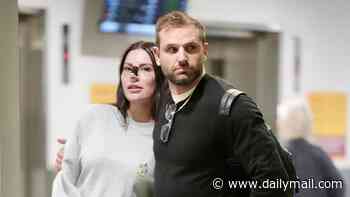 Married At First Sight groom Scott McCristal plays the doting boyfriend as he returns from Turkey with Brienna Stockdale following her nose job