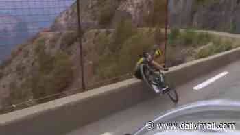 Terrifying moment American cyclist narrowly avoids fatal crash over cliff during Tour de France