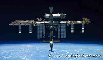 A U.S.-Russian space crew lands safely in Kazakhstan after an 8-month stint on the ISS