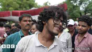 Protesters celebrate resignation of India's education minister